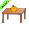 The pumpkin ins ON the table.